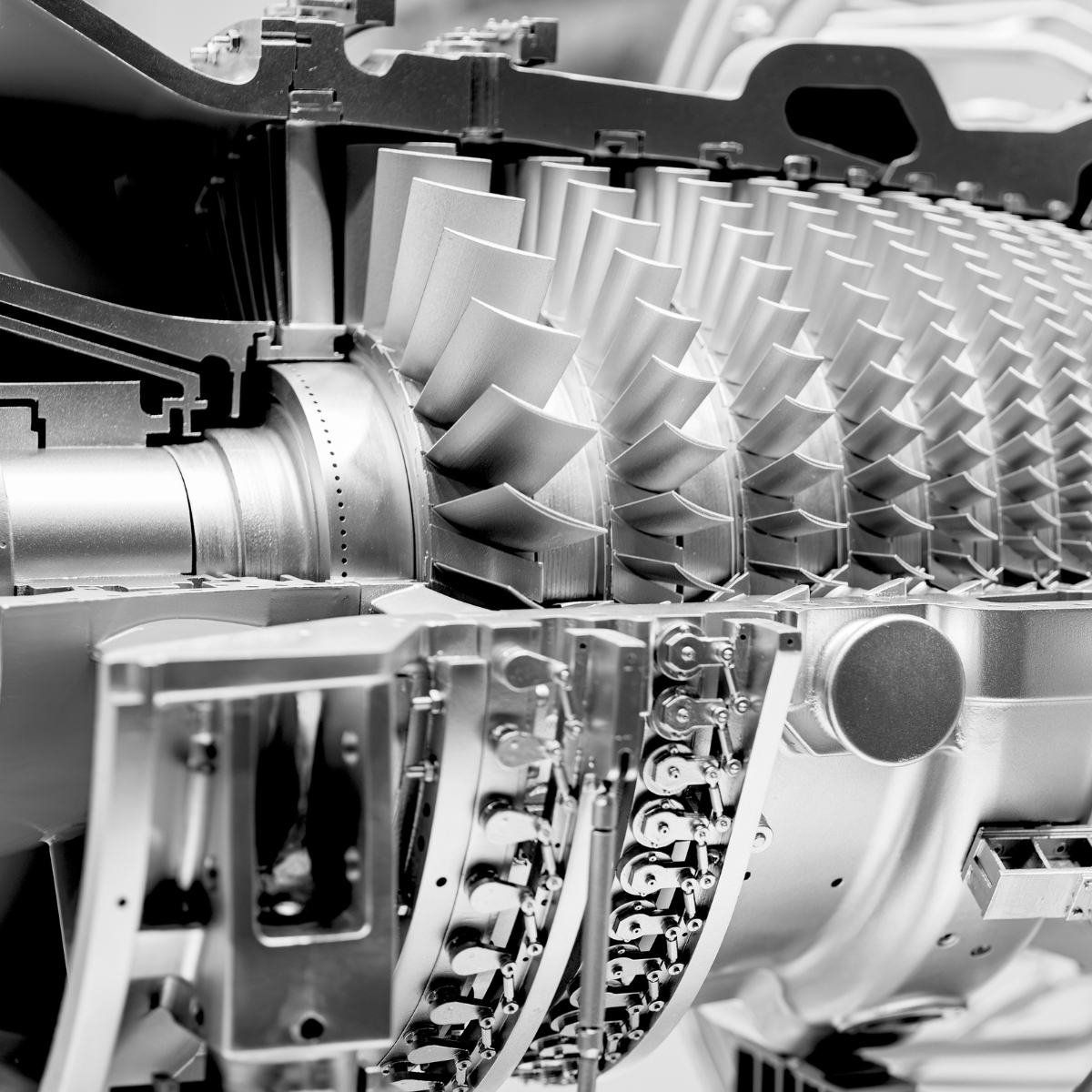 Cutaway view of an aeroderivative gas turbine, showcasing the intricate design of its compressor blades and internal mechanisms, highlighting its efficiency and engineering precision.
