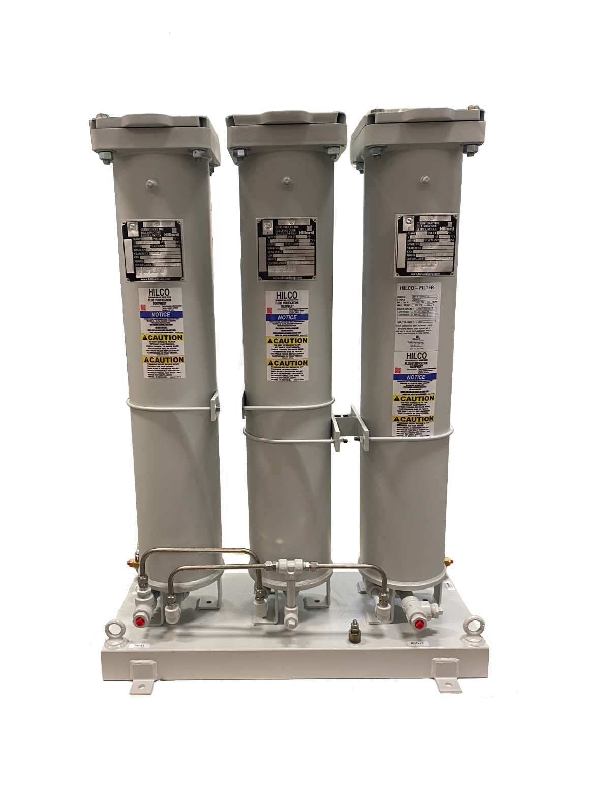 Industrial filtration system used in nuclear power applications, featuring three cylindrical filters mounted on a base with labeled components and cautionary notices.