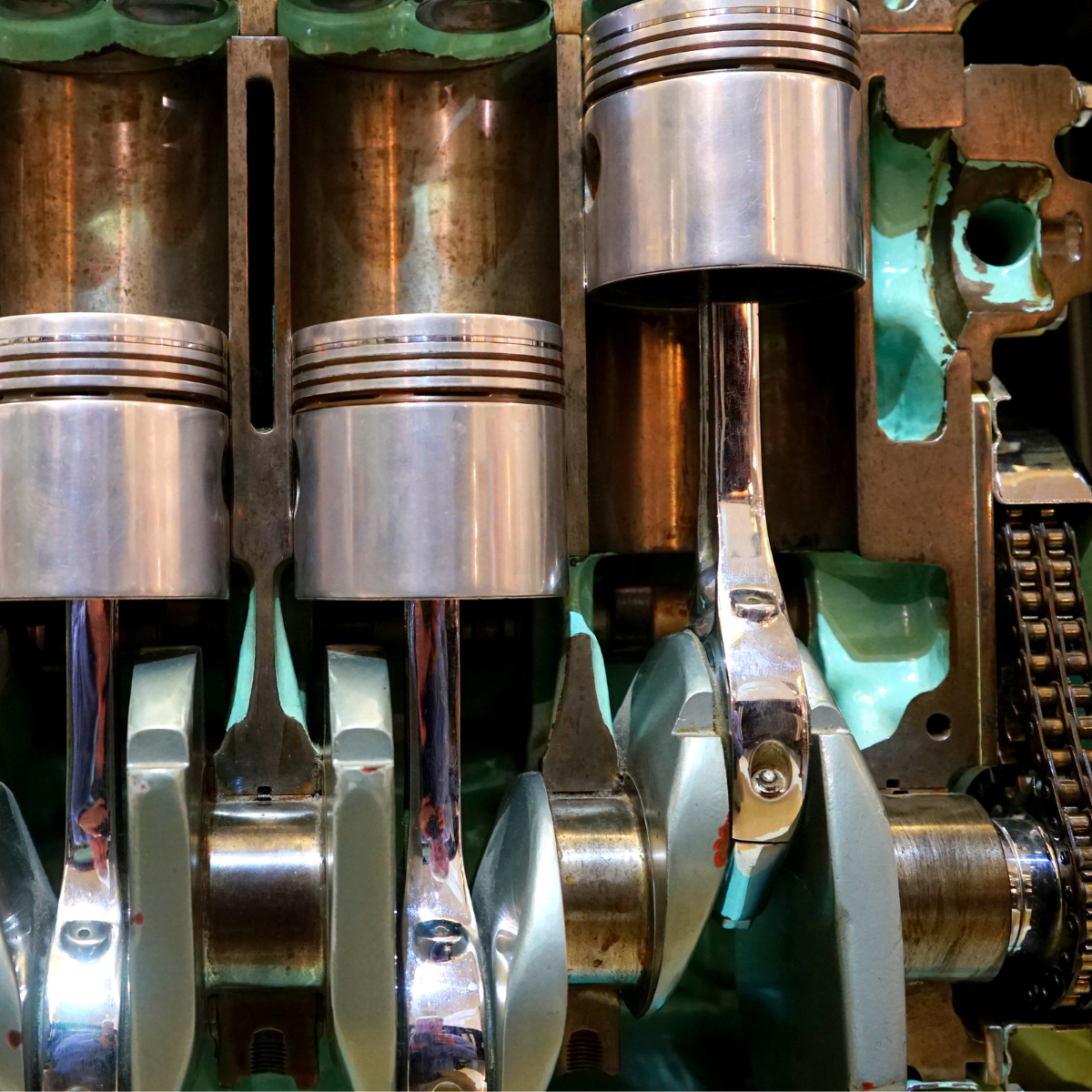 Close-up view of the internal components of a reciprocating engine, showcasing pistons, connecting rods, and crankshaft within the engine block.